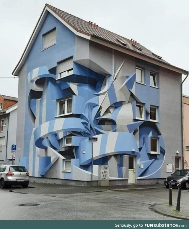 The paint job on this house in Germany gives it an illusion that the house is warped