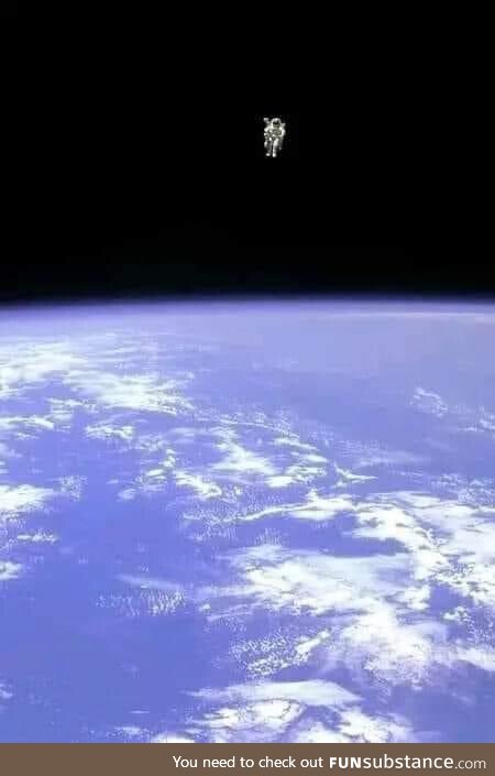 Astronaut Bruce McCandless II floats untethered, away from the space shuttle