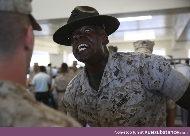 USMC Drill Instructor being nice to a new recruit during inspection