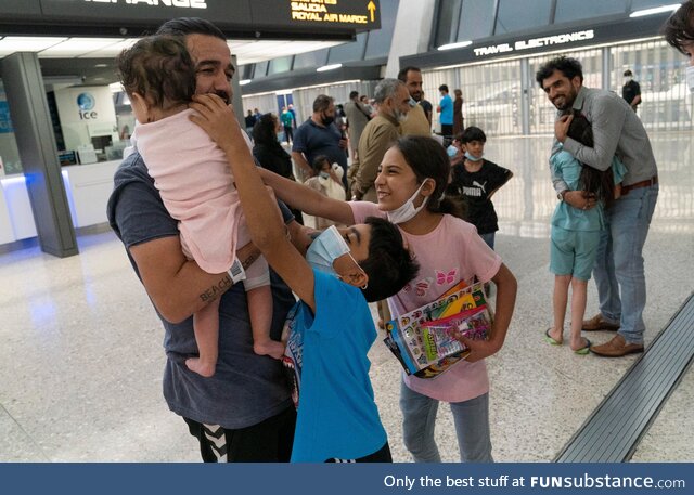 A family from Afghanistan arrives at Dulles International Airport in Chantilly, Virginia