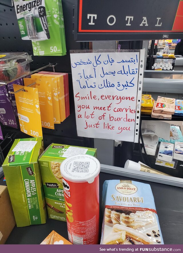 A note near the grocery shop's cashier that is situated in the heart of a desert