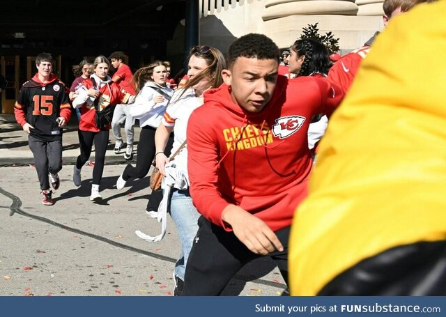 People flee after shots were fired near the Kansas City Chiefs’ parade in Kansas City,