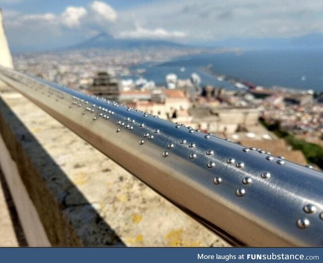 This railing on gazebo in Naples, Italy has braille describing the view for blind people