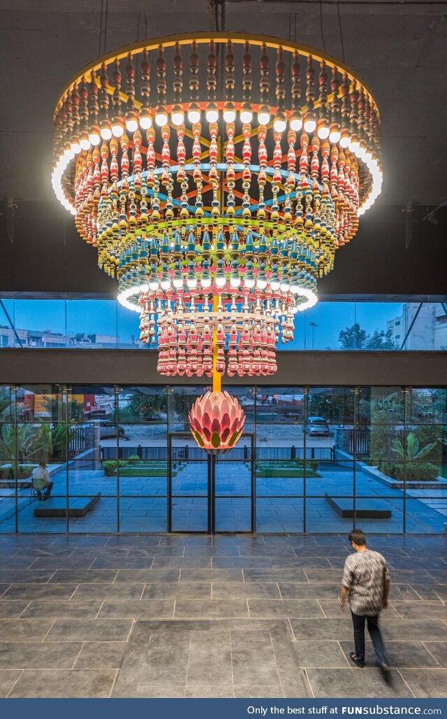 Bloom, a chandelier I completed in 2020 with wood/wax lacqueenamel/metal