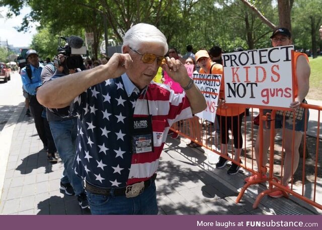 Man with An American flag shirt, reaction to kids protesting gun violence in their