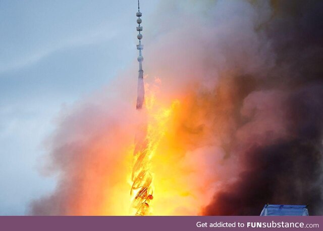 Copenhagen's stock exchange spire on fire, shortly before its collapse