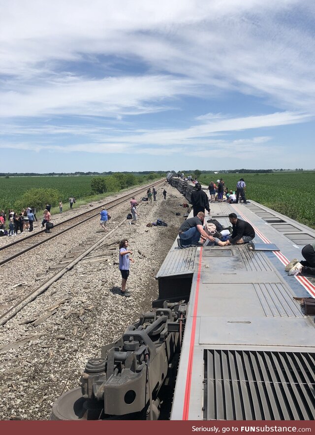 News: Two Mennonite farmers appear to be helping evacuate derailed train. Goodness in