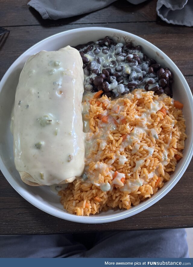 Homemade chimichanga, Mexican rice, black beans, green chili queso