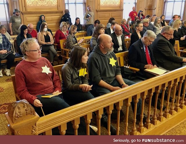 Anti-vaxxers showing up to municipal meetings wearing yellow stars, Kansas