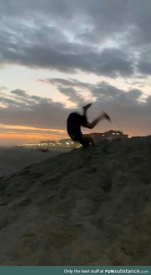 [OC] Me at the beach, casually tumbling down the lifeguard mound