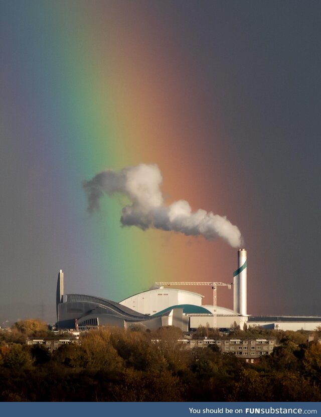 A rainbow behind a factory in East London