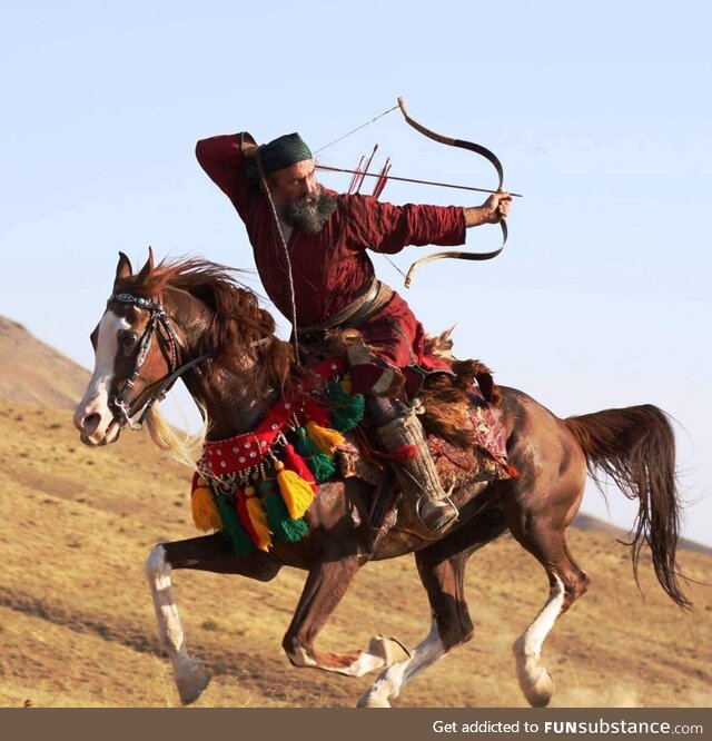 Ali Ghoorchian, an Iranian world-champion horseback archer, performs the famous Parthian