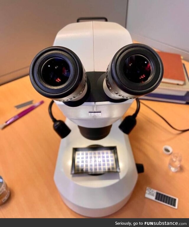 This microscope looks like a robot, with tiny hands and lips