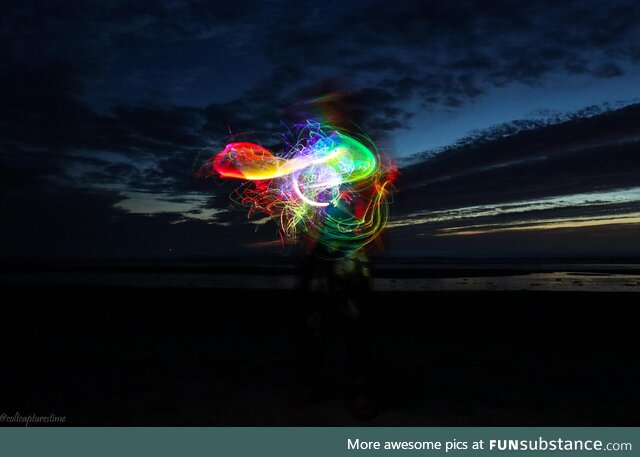 Making light jelly fish at the beach. Long exposure picture of an LED light whip