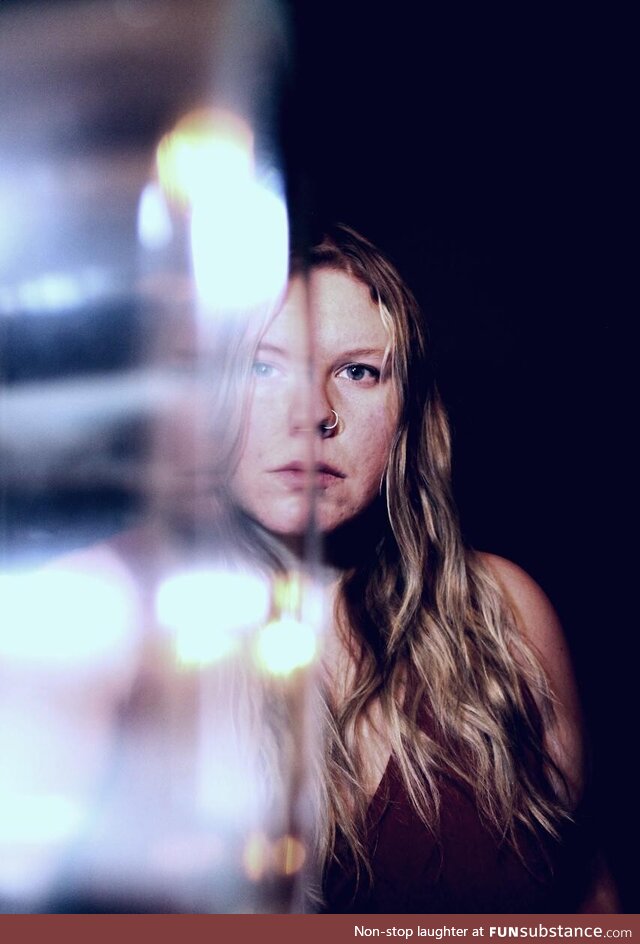 Self portrait using a window ledge and candle holder