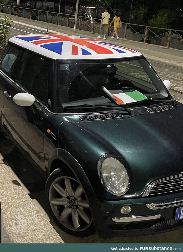 Milan, Italy Euro Finals Mini Cooper with English livery on the hood prints Italian flag