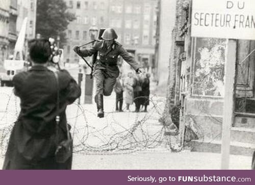 East German soldier escapes by jumping over barbed wire