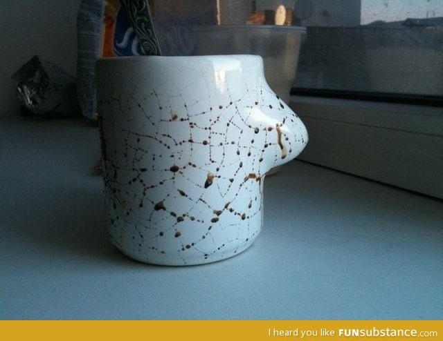 Coffee leaking out the cracks of a mug