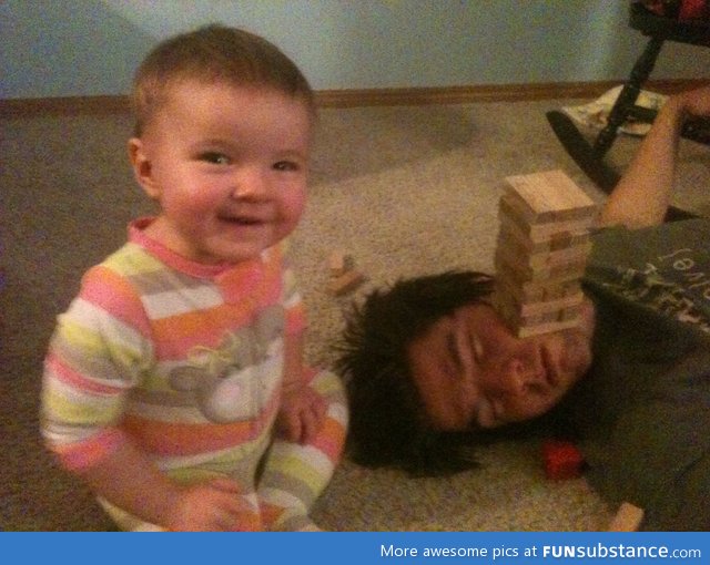 Husband fell asleep so daughter and I started playing jenga on his face