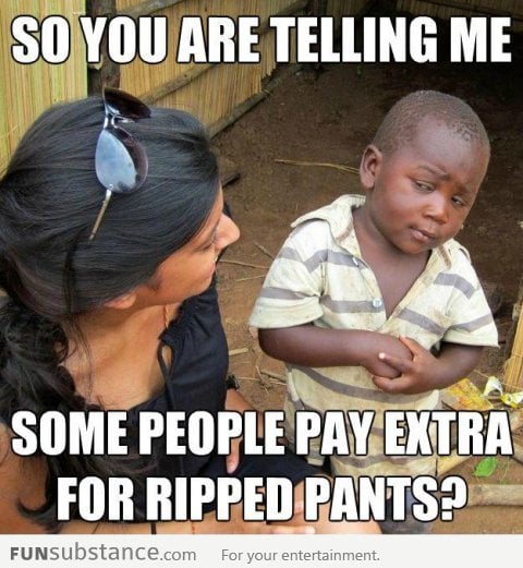 Skeptical 3rd world kid on ripped jeans