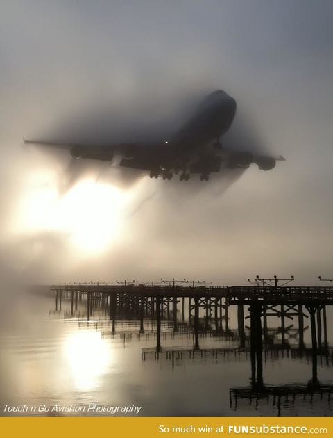747 cutting through the fog