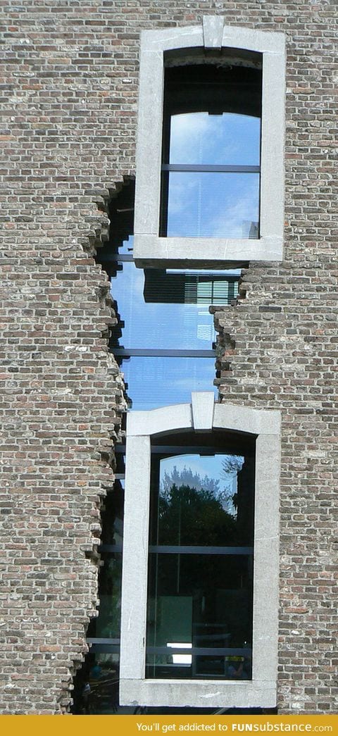 Really interesting cracked building window design in the Netherlands