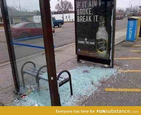 I blame the advertisement for what happened to this bus shelter