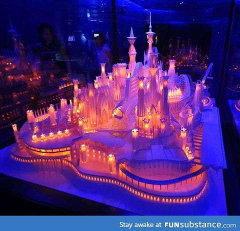 A beautifully lit castle made entirely out of paper