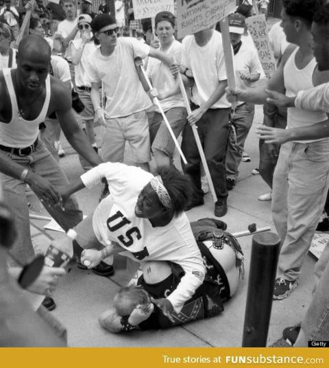 18-year-old Keshia Thomas falls on Ku Klux Klan member to protect him from a mob