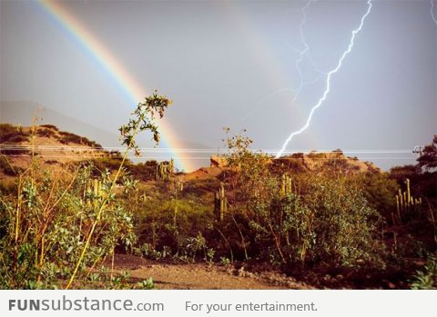 Perfect moment of rainbow + lightning