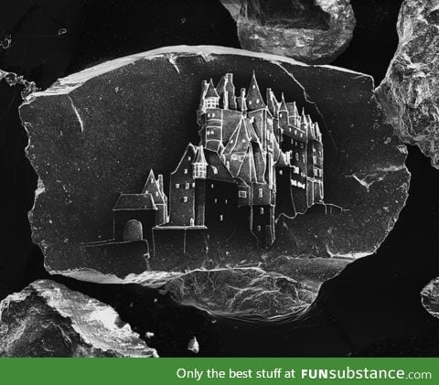 World's Smallest Sandcastle, Etched on a Single Grain of Sand