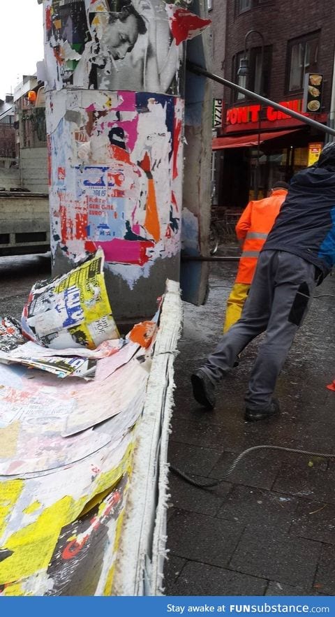 Posters being peeled off
