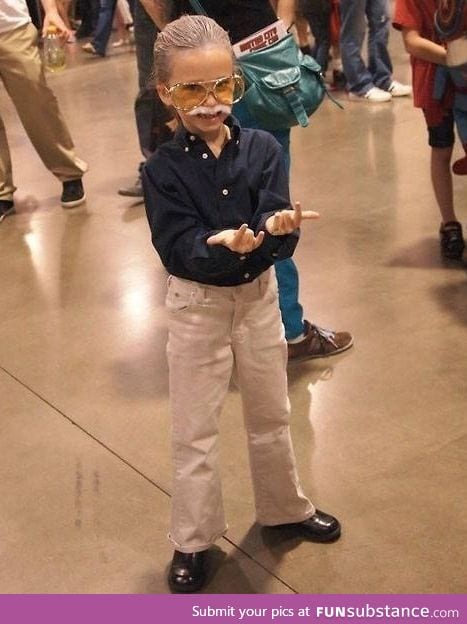 Little girl dressed up as Stan Lee