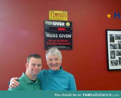 Tim Harris a restaurant owner in the US with Down Syndrome, serves food & hugs.