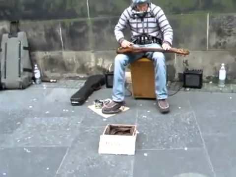 Street musician is insanely good at playing multiple instruments simultaneosly