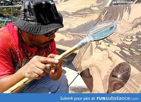 Artists uses the sun and magnifying glass to create intricate works of art