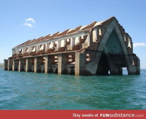 Arches of a church that is abandoned in Brazil being swallowed by the sea