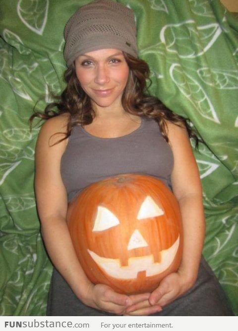 She is holding a pumpkin, or is she?