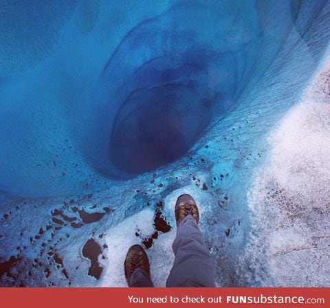 1000 ft hole found at Lower Ruth Glacier in Alaska covered only by a sheet of clear ice