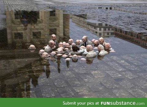 This is a statue in Berlin called "Politicians discussing Global Warming."