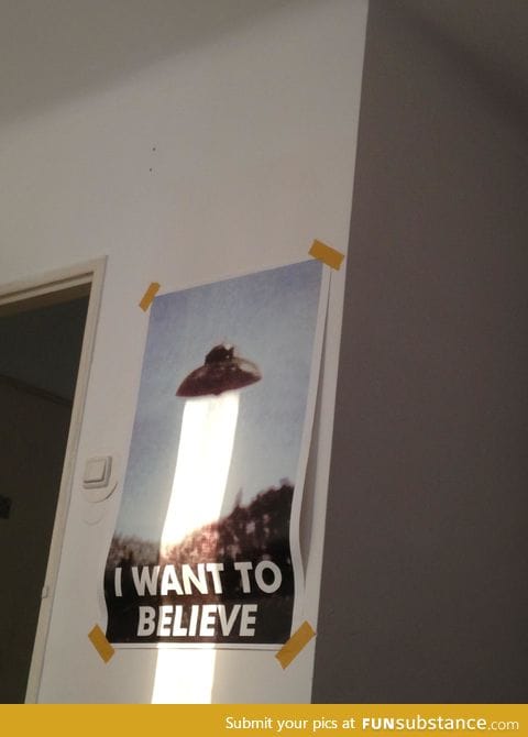 UFO on poster greatly enhanced by sunbeam
