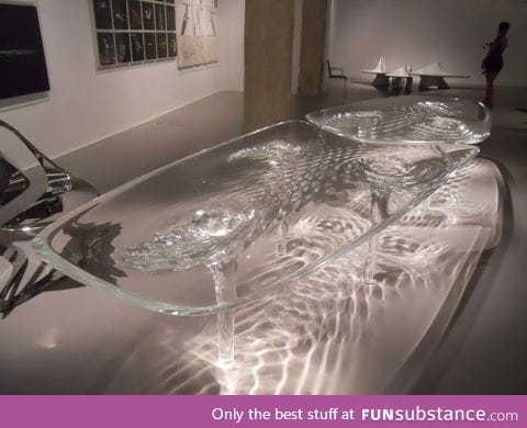 Glass table made to look like flowing water
