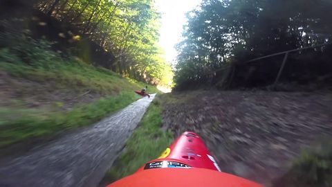 Guys kayaks lose control down a drainage ditch