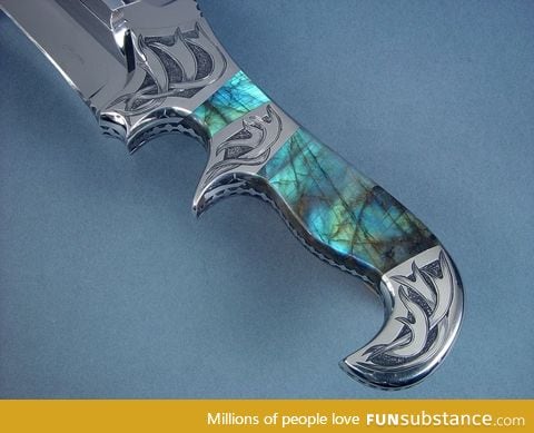 A knife with a handle made of the mineral Labradorite