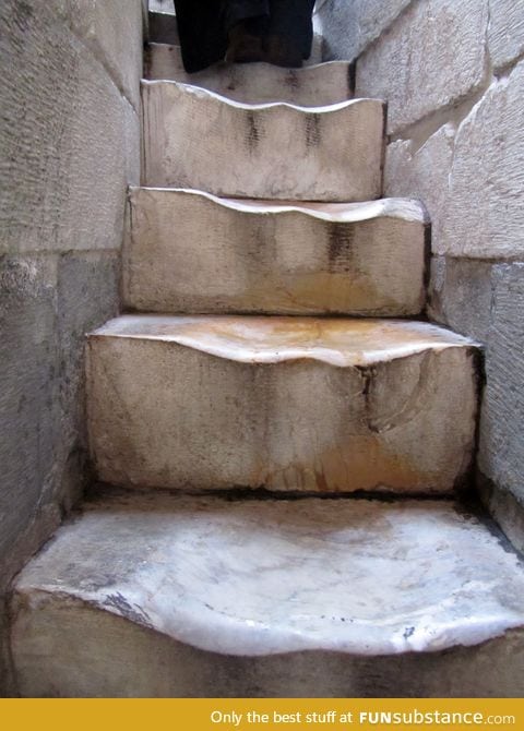 500 years of walking up the marble stairs of The Leaning Tower of Pisa