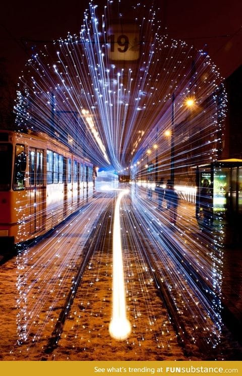 Long exposure of a departing Tram in Budapest covered with 30,000 LEDs