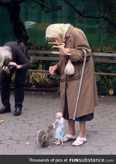 Old Woman using a Marionette to feed Squirrels