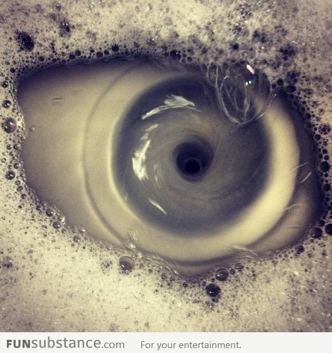 Sink draining, looks like a picture of an eye