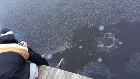 Guy shoots rocket under the ice of frozen lake