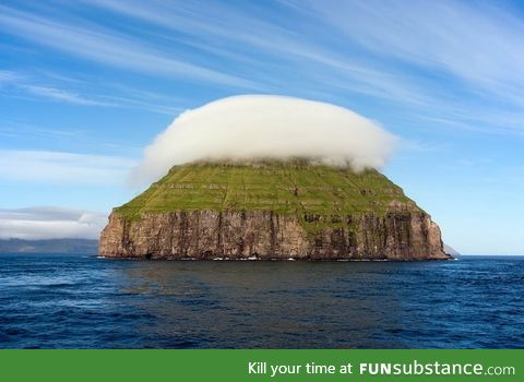 The cloud covered island of Litla Dimun, the largest uninhabited Faroe Island
